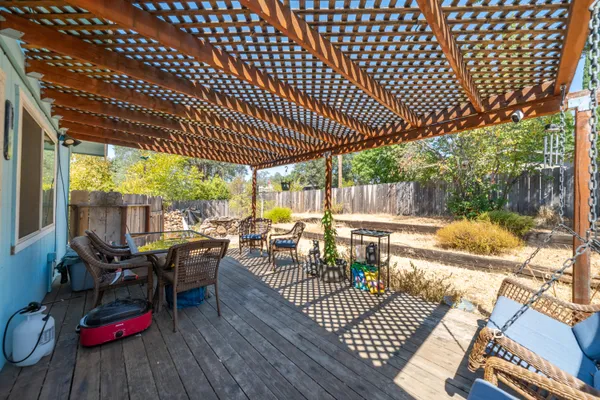 a view of back yard with patio