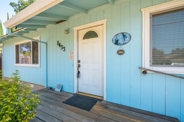 a view of a hallway with wooden floor and a hallway