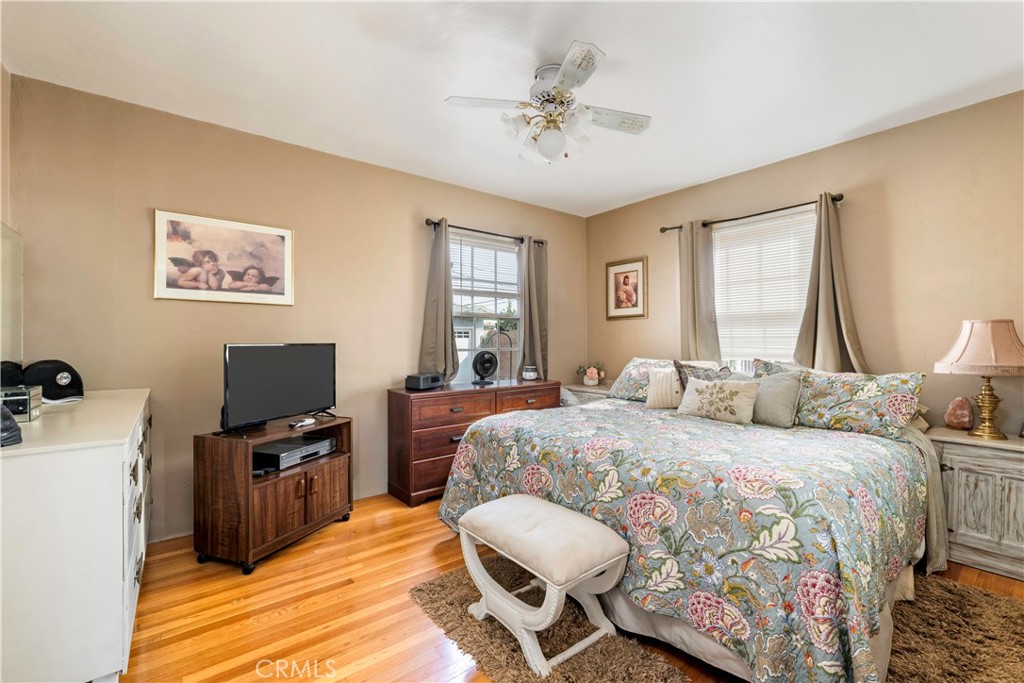 5016 Falcon Avenue Long Beach, CA 90807 - Photo 12 of 23 a bedroom with a bed and a flat screen tv