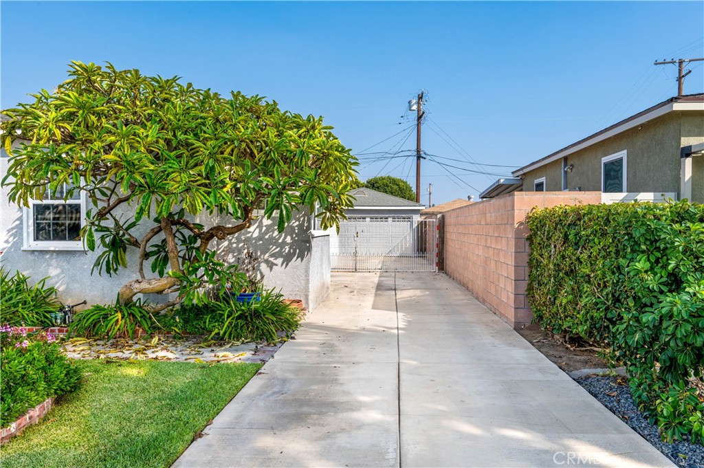 5016 Falcon Avenue Long Beach, CA 90807 - Photo 15 of 23 a front view of a house with a yard and potted plants