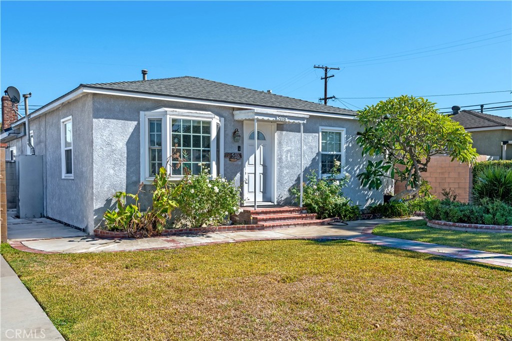 5016 Falcon Avenue Long Beach, CA 90807 - Photo 20 of 23 a front view of a house with a yard