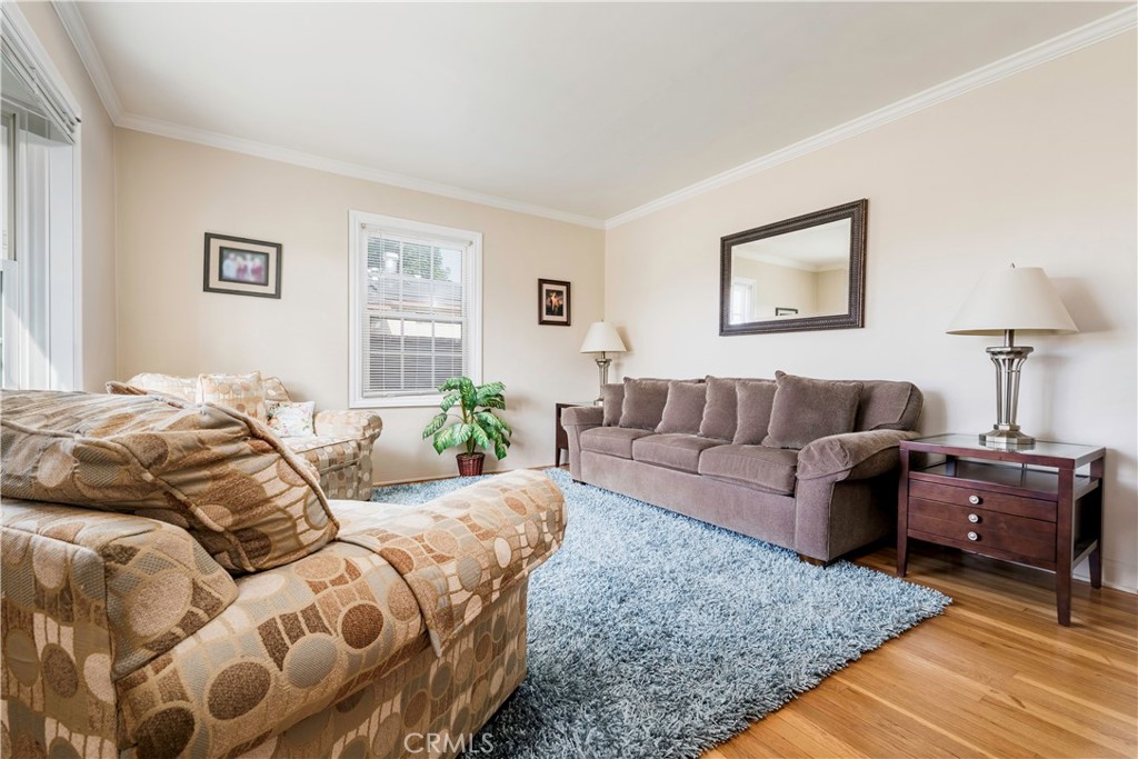 5016 Falcon Avenue Long Beach, CA 90807 - Photo 2 of 23 a bedroom with a bed and a couch