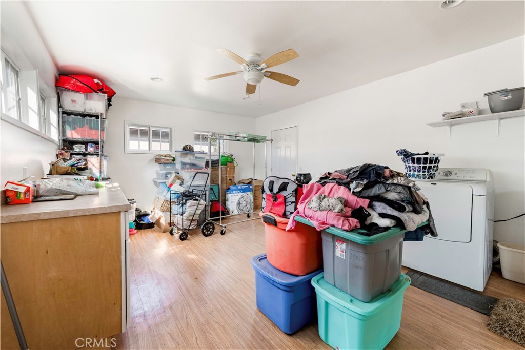 5016 Falcon Avenue Long Beach, CA 90807 - Photo 21 of 23 a living room with furniture and a gym machine