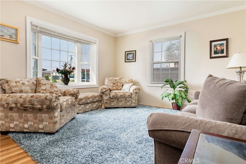 5016 Falcon Avenue Long Beach, CA 90807 - Photo 3 of 23 a living room with furniture and a potted plant