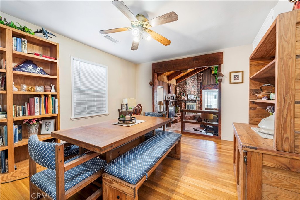 5016 Falcon Avenue Long Beach, CA 90807 - Photo 5 of 23 a living room with furniture a bookshelf and a window