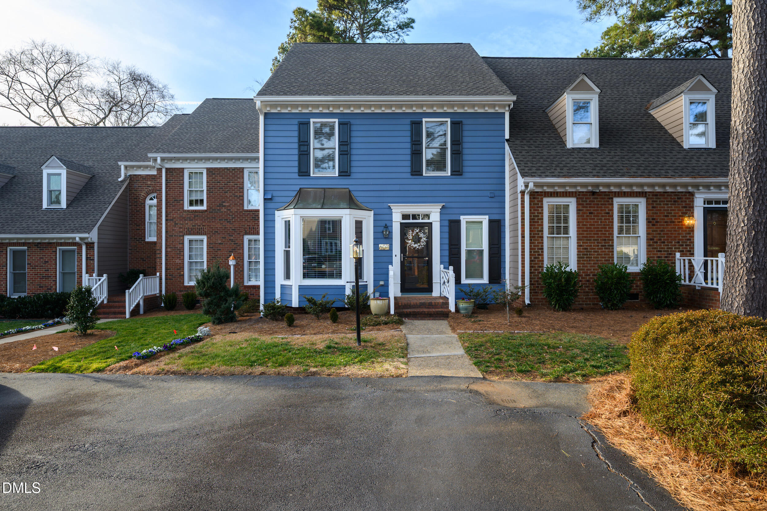 6011 Tenter Banks Square Raleigh, NC 27609 - Photo 1 of 37 a front view of a house with a garden
