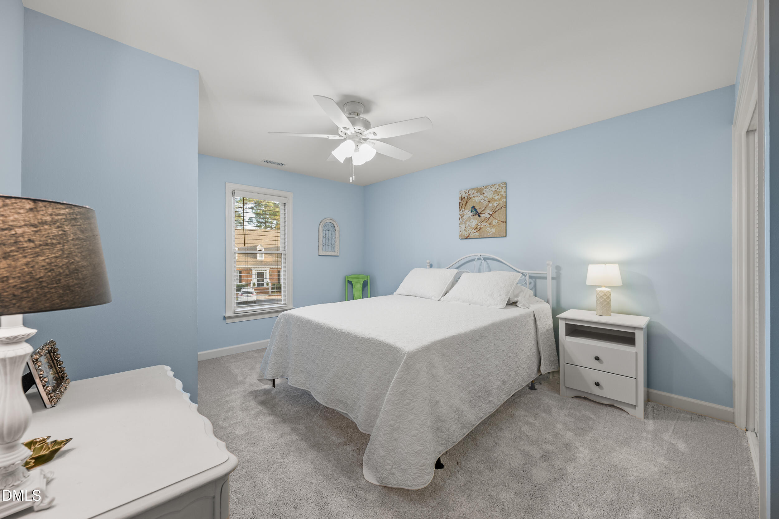 6011 Tenter Banks Square Raleigh, NC 27609 - Photo 20 of 37 a spacious bedroom with a bed and a window