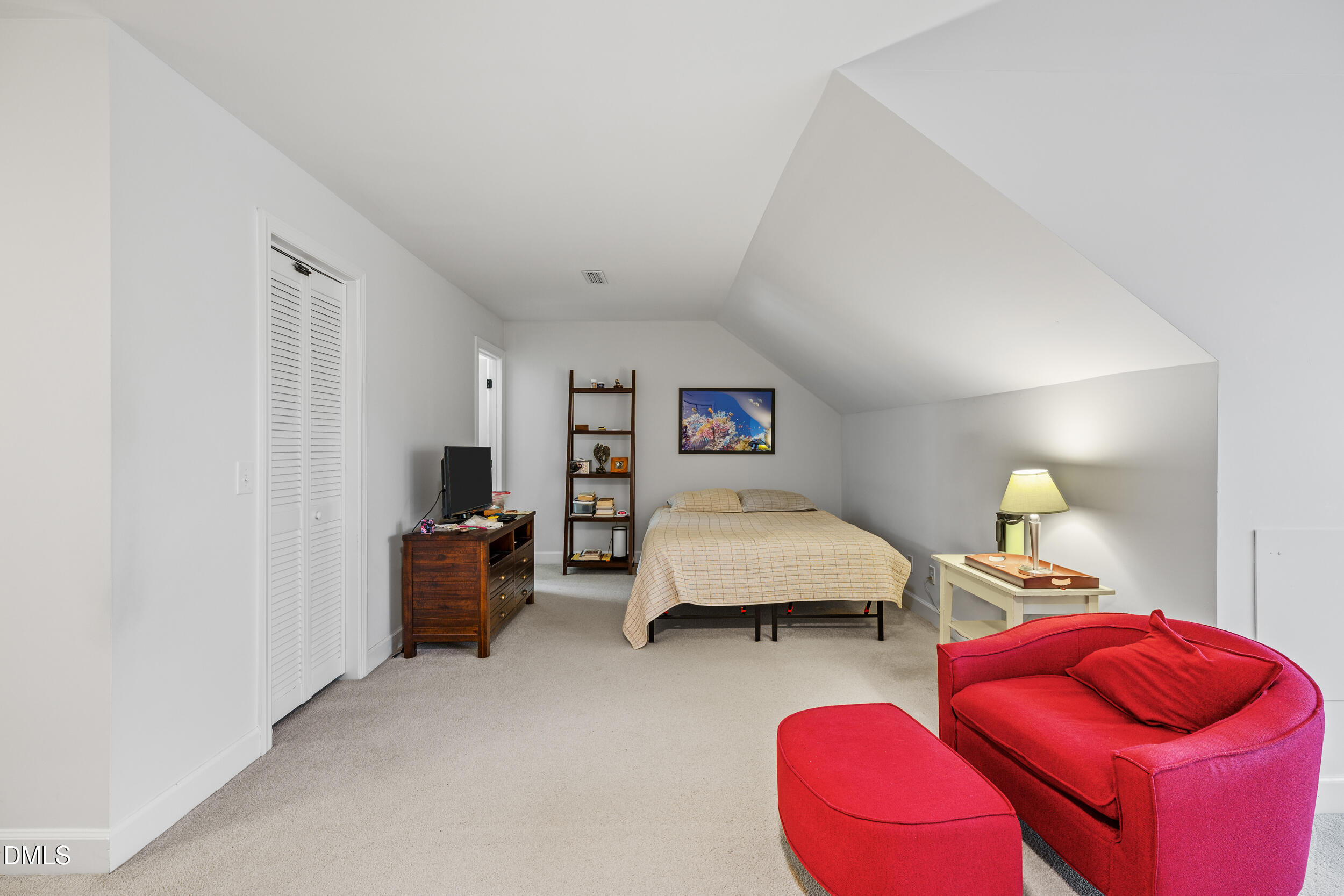 6011 Tenter Banks Square Raleigh, NC 27609 - Photo 30 of 37 a bedroom with furniture and a couch