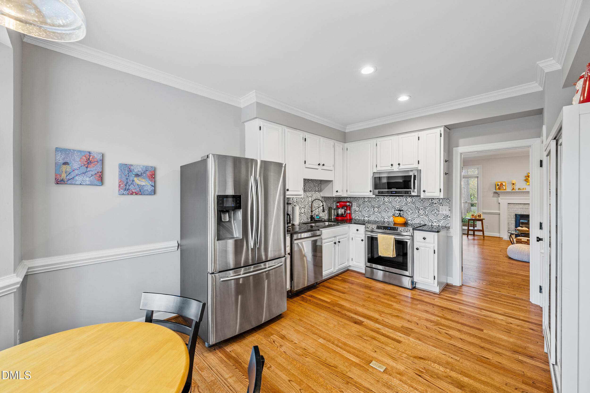 6011 Tenter Banks Square Raleigh, NC 27609 - Photo 8 of 37 a kitchen with stainless steel appliances a refrigerator and a stove top oven