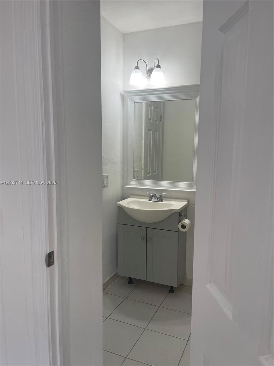 317 East 8th Street, Unit 3 Hialeah, FL 33010 - Photo 12 of 19 a utility room with sink dryer and washer