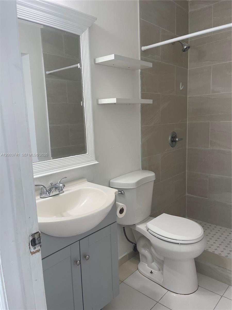 317 East 8th Street, Unit 3 Hialeah, FL 33010 - Photo 13 of 19 a bathroom with a sink toilet and shower
