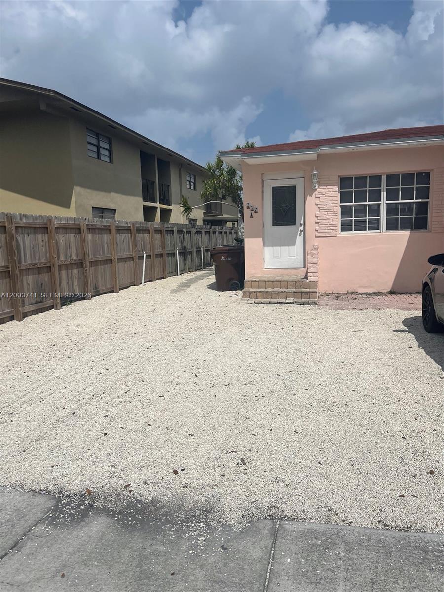 317 East 8th Street, Unit 3 Hialeah, FL 33010 - Photo 2 of 19 a bathroom with a sink and a stove