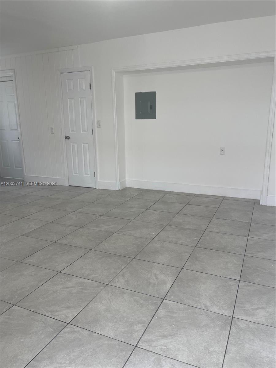 317 East 8th Street, Unit 3 Hialeah, FL 33010 - Photo 6 of 19 a view of an empty room with a window