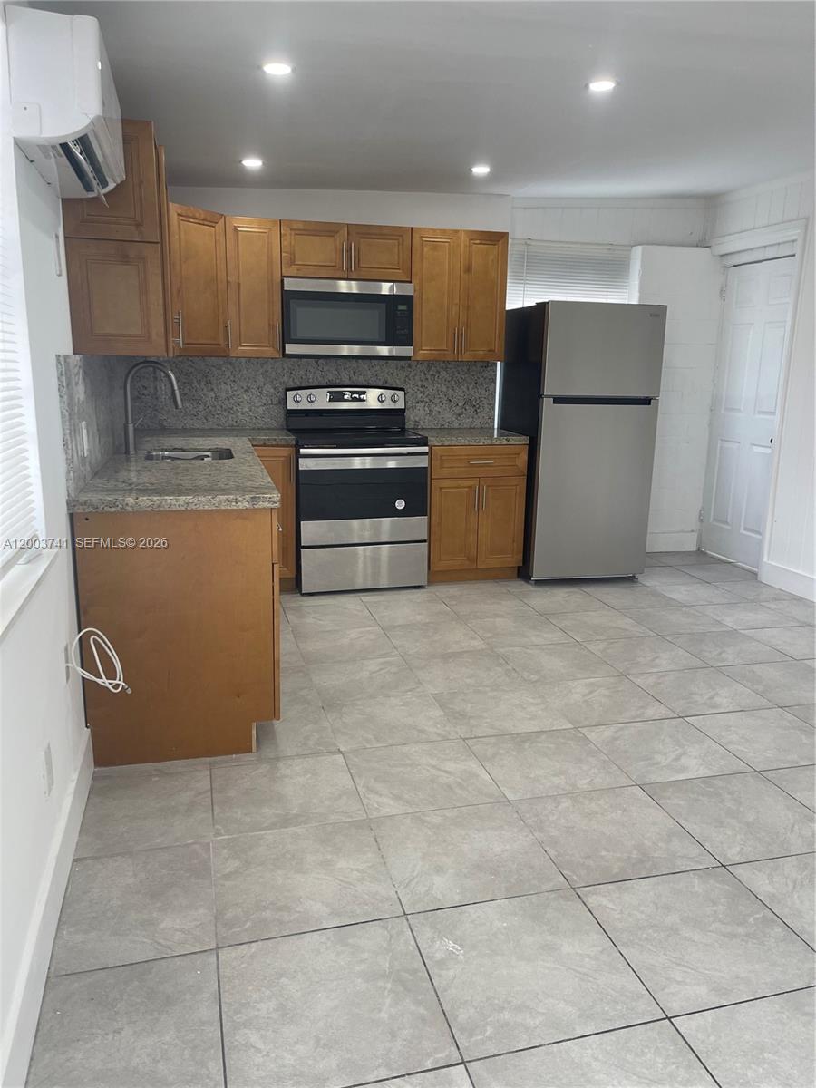 317 East 8th Street, Unit 3 Hialeah, FL 33010 - Photo 7 of 19 a kitchen with a cabinets and steel appliances