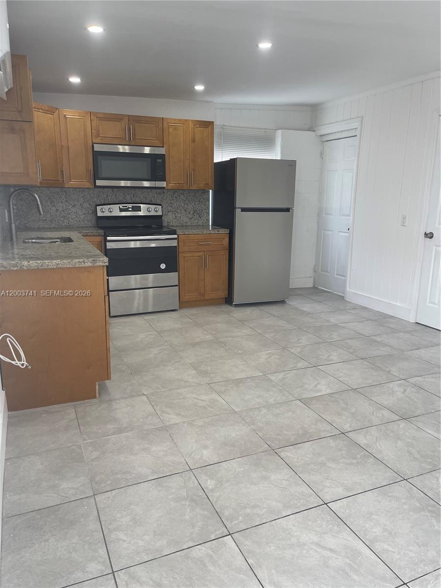317 East 8th Street, Unit 3 Hialeah, FL 33010 - Photo 8 of 19 a kitchen with a cabinets and steel appliances