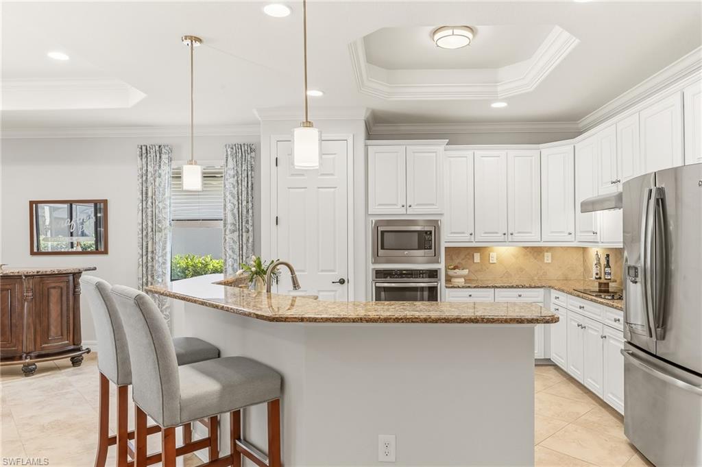 12614 Fenhurst Way Naples, FL 34120 - Photo 7 of 44 Wrap-a-round island, new pendant lighting