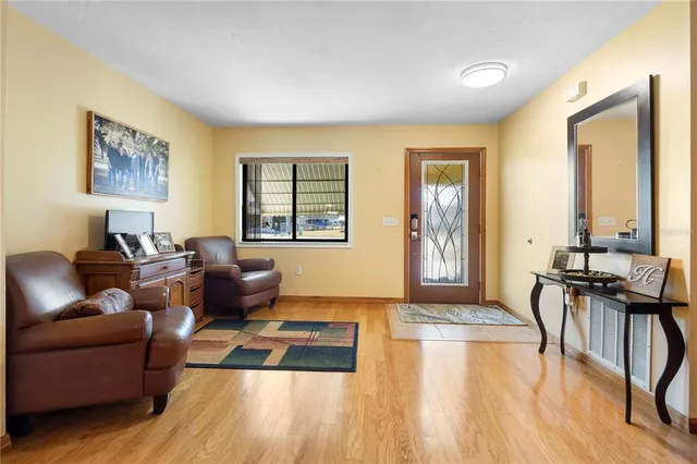 a living room with furniture and a table