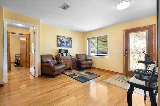 a living room with furniture and a window