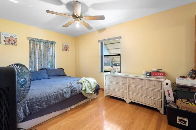 a bed room with a bed and a chandelier