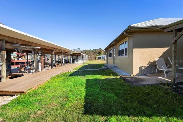 a view of yard with patio