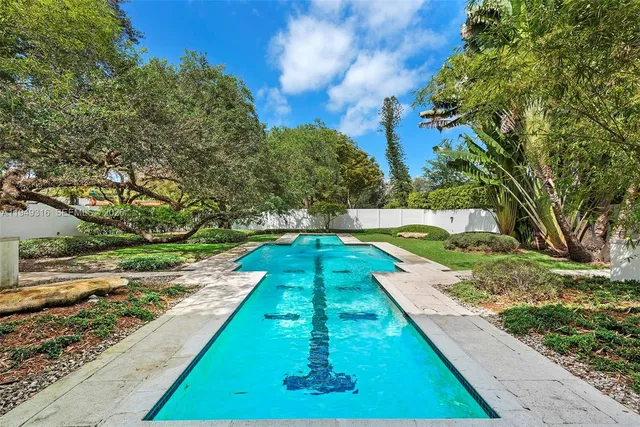 a view of swimming pool with a yard