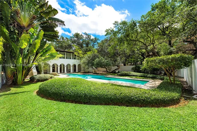 a backyard of a house with lots of green space