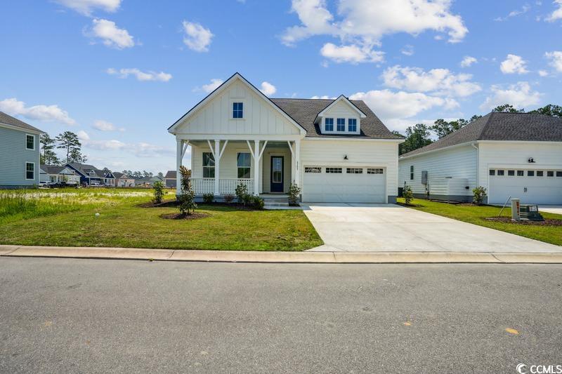 6709 Genesis Drive Murrells Inlet, SC 29576 - Photo 1 of 14 View of front facade featuring board and batten si