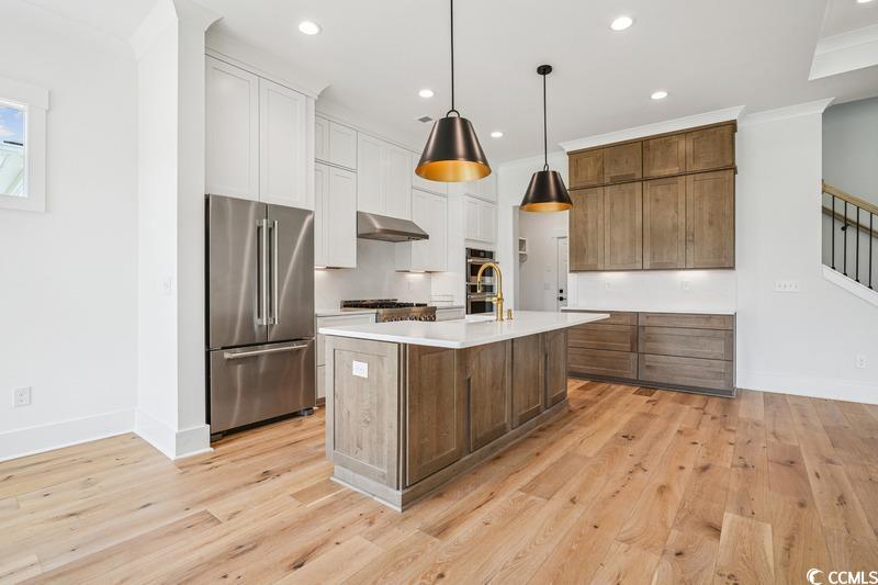 6709 Genesis Drive Murrells Inlet, SC 29576 - Photo 5 of 14 Kitchen featuring stainless steel appliances, ligh