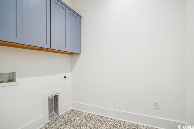 6709 Genesis Drive Murrells Inlet, SC 29576 - Photo 7 of 14 Washroom with cabinet space, hookup for an electri