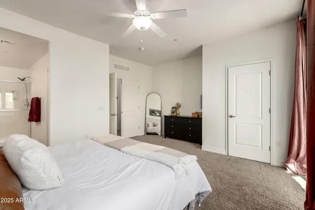 a bedroom with a bed and window