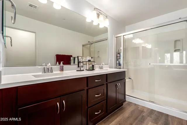 a bedroom with a bed and a mirror