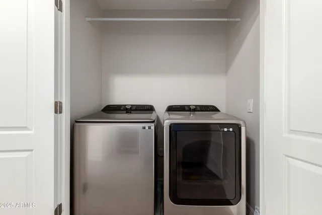 a bathroom with a sink double vanity and a mirror