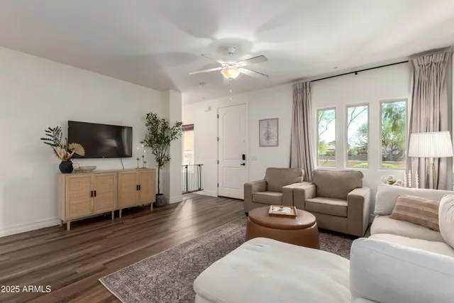 a living room with furniture and a flat screen tv