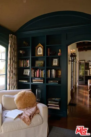 a kitchen with a stove and a potted plant
