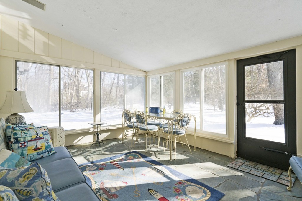 62 Rust Way Cohasset, MA 02025 - Photo 10 of 17 a living room with furniture and large windows