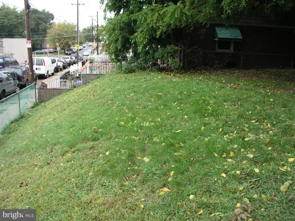 a view of a backyard with sitting area