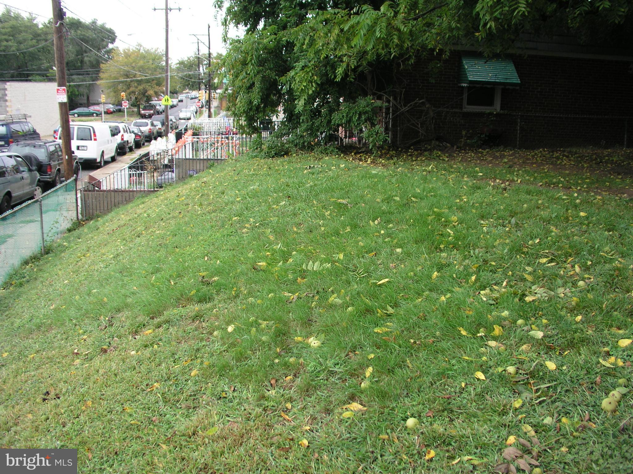a view of a backyard with sitting area