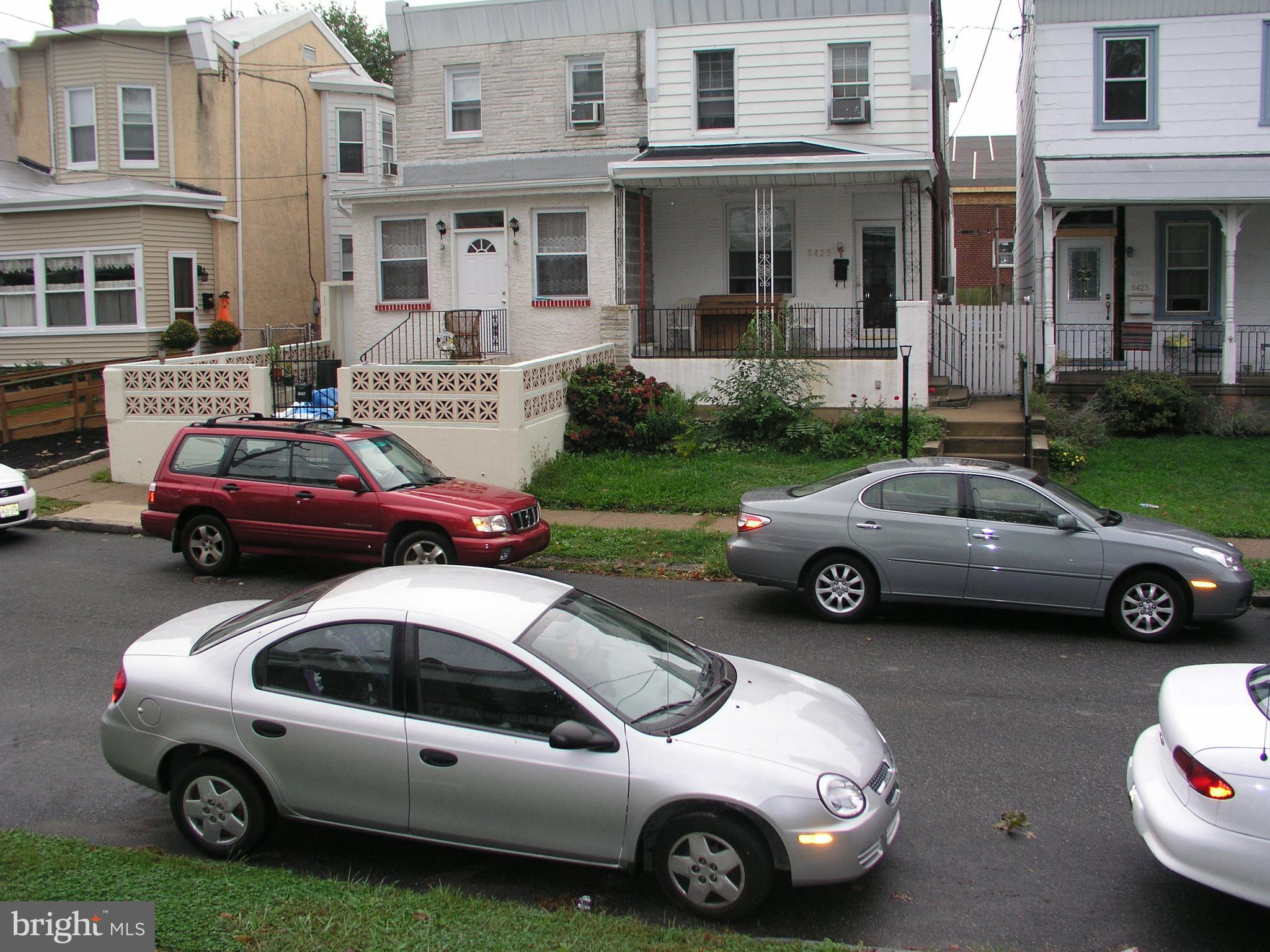 6422 Tulip Street Philadelphia, PA 19135 - Photo 2 of 4 a front view of a house with parking space