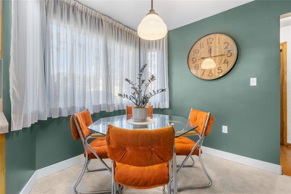 357 Churchill Road Pittsburgh, PA 15235 - Photo 11 of 28 a dining room with furniture and a large mirror