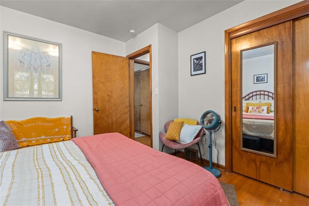 357 Churchill Road Pittsburgh, PA 15235 - Photo 14 of 28 a bedroom with a bed and a dresser next to a window
