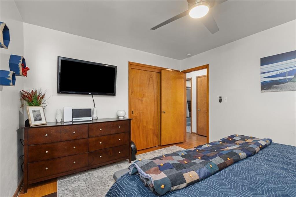 357 Churchill Road Pittsburgh, PA 15235 - Photo 20 of 28 a bedroom with a bed and a flat screen tv