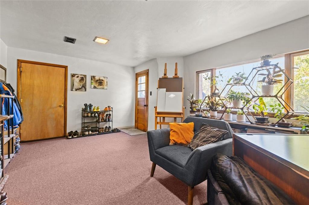 357 Churchill Road Pittsburgh, PA 15235 - Photo 22 of 28 a living room with furniture and a flat screen tv