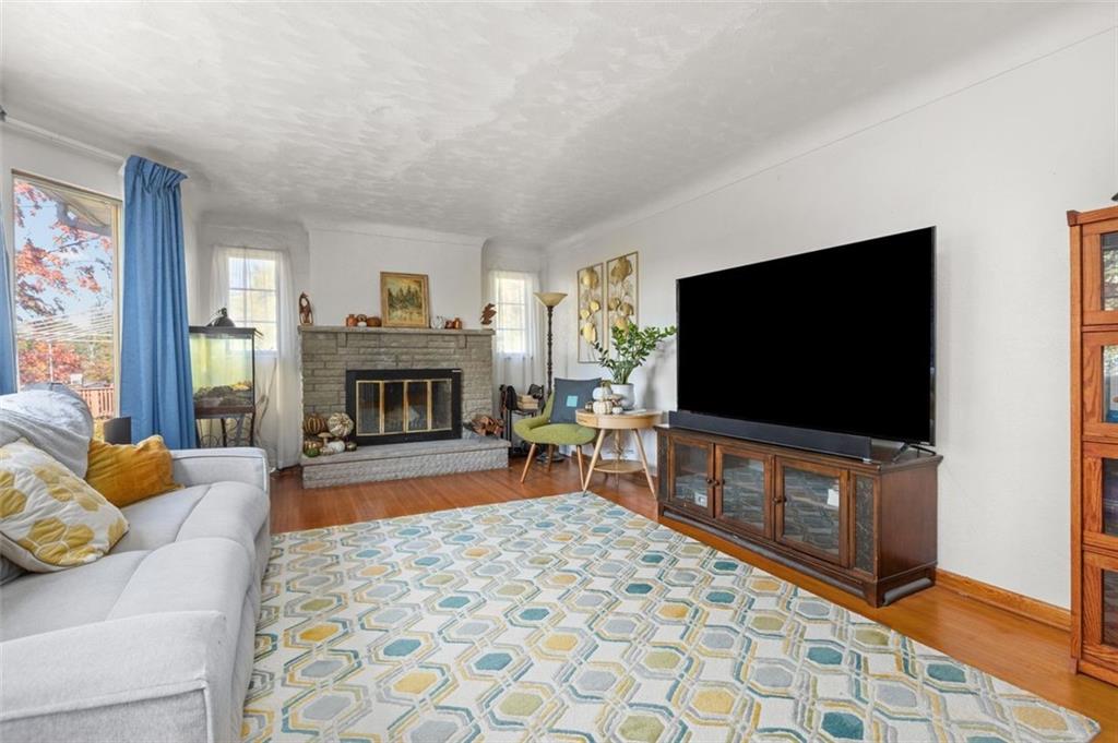 357 Churchill Road Pittsburgh, PA 15235 - Photo 4 of 28 a living room with furniture and a flat screen tv