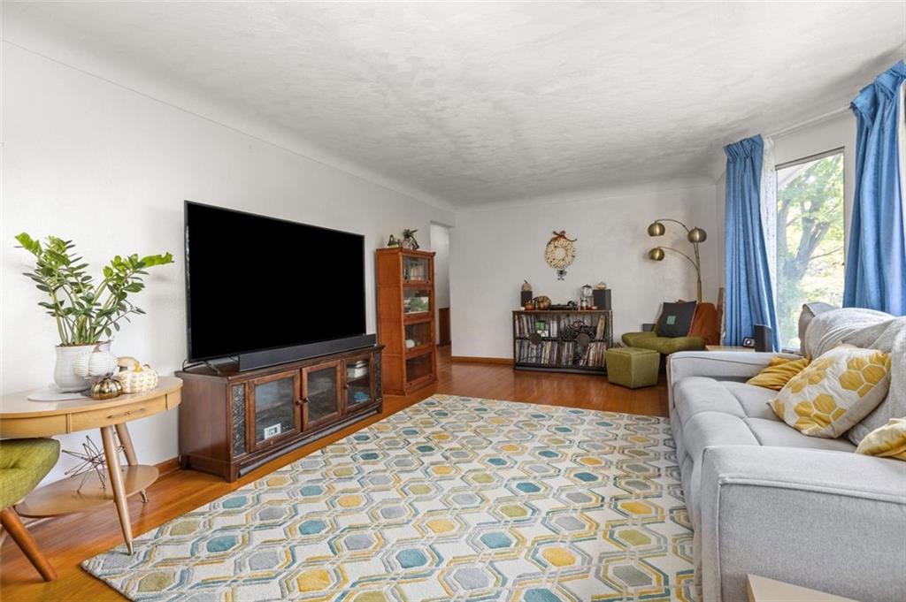 357 Churchill Road Pittsburgh, PA 15235 - Photo 5 of 28 a living room with furniture and a flat screen tv