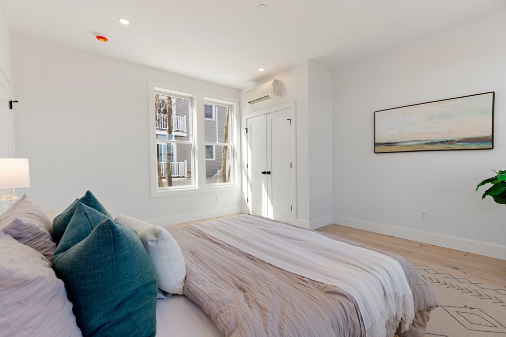 656 Mystic Avenue, Unit B Somerville, MA 02145 - Photo 17 of 40 a bedroom with a bed and a window