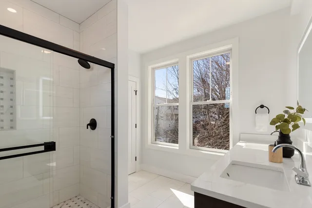 a bathroom with a sink and a shower