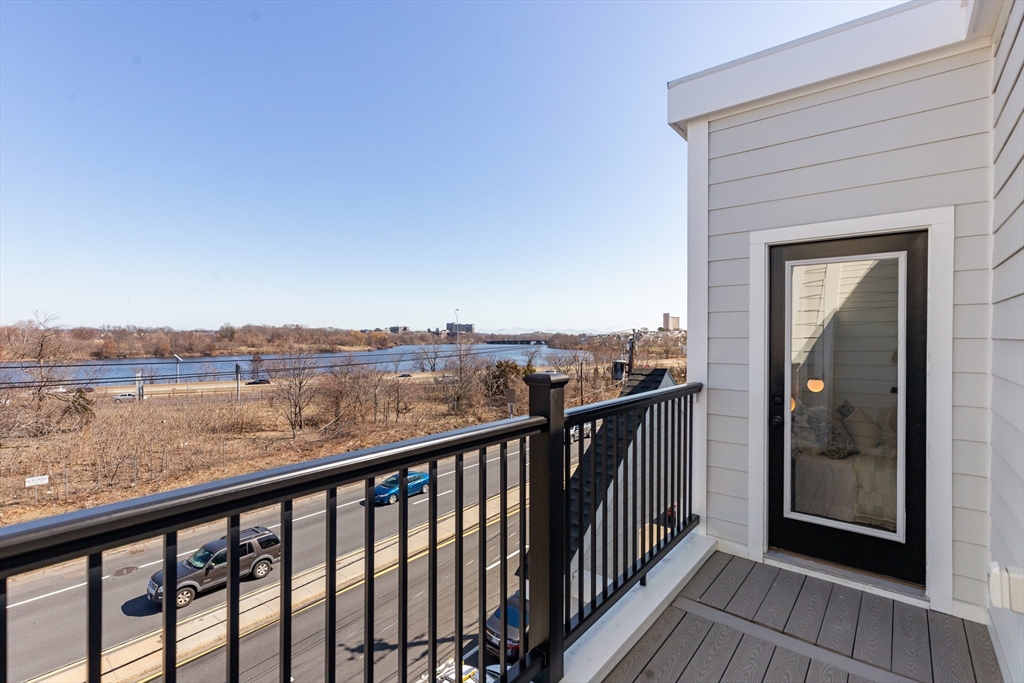 656 Mystic Avenue, Unit B Somerville, MA 02145 - Photo 30 of 40 a view of city and mountain from a balcony