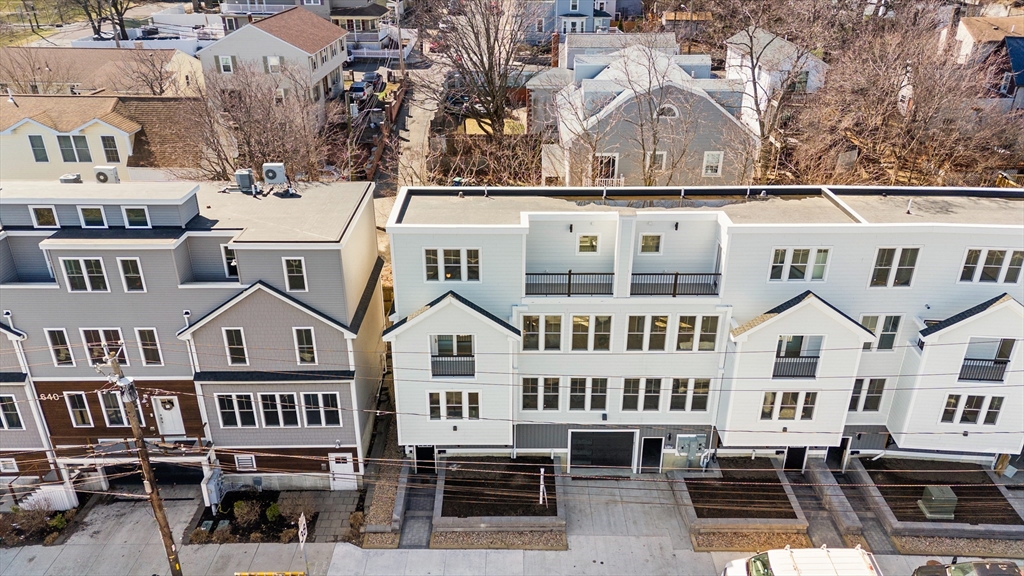 656 Mystic Avenue, Unit B Somerville, MA 02145 - Photo 37 of 40 an aerial view of residential houses with cars parked