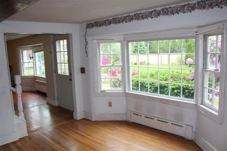 1 Cross Road Bourne, MA 02532 - Photo 14 of 22 a view of an empty room with wooden floor and a window
