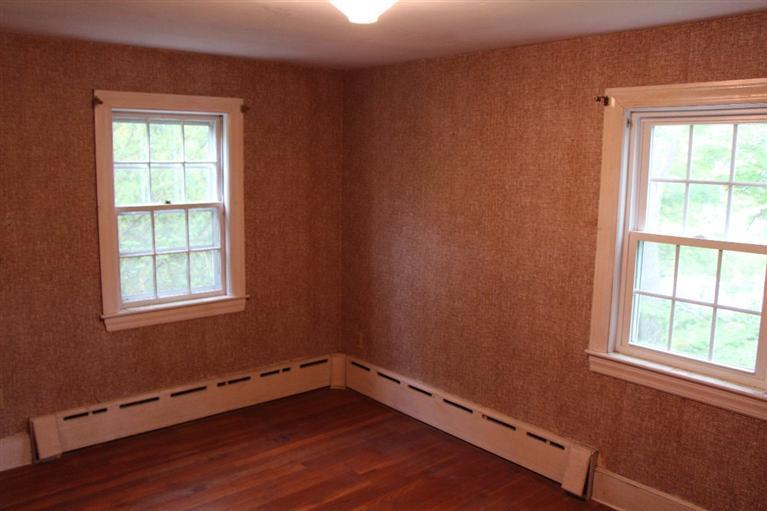 1 Cross Road Bourne, MA 02532 - Photo 15 of 22 an empty room with wooden floor and windows